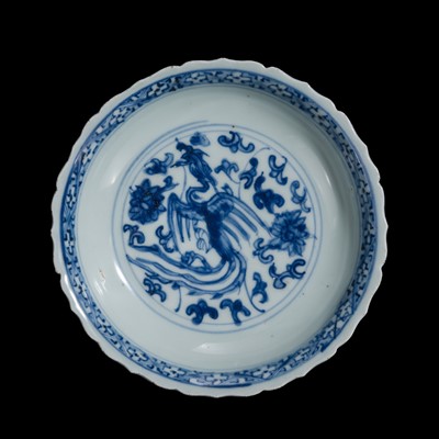 Lot 200 - A BARBED BLUE AND WHITE ‘PHOENIX’ PORCELAIN DISH, QING DYNASTY