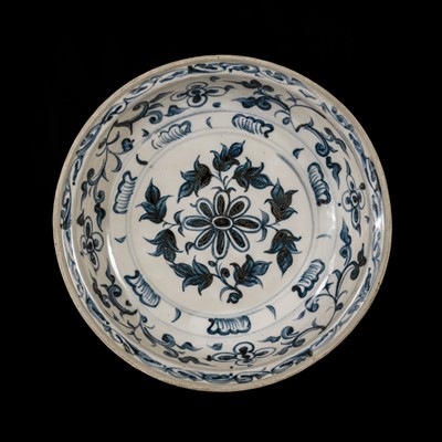 Lot 44 - AN ANNAM BLUE AND WHITE-GLAZED STONEWARE ‘FLORAL’ DISH, 15TH-16TH CENTURY