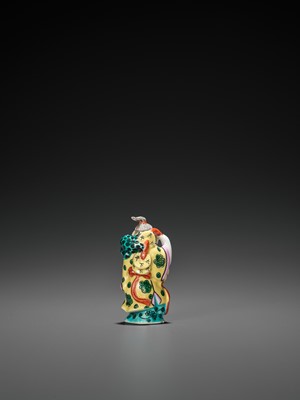 Lot 396 - A MOLDED AND ENAMELED PORCELAIN ‘LIU HAI AND TOAD’ SNUFF BOTTLE, REPUBLIC