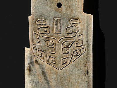 Lot 76 - A LARGE AND INSCRIBED JADE ‘TAOTIE’ CEREMONIAL DAGGER-AXE (GE), LATE SHANG DYNASTY, ANYANG PHASE