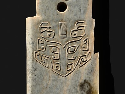 Lot 76 - A LARGE AND INSCRIBED JADE ‘TAOTIE’ CEREMONIAL DAGGER-AXE (GE), LATE SHANG DYNASTY, ANYANG PHASE