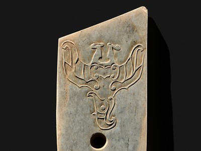 Lot 76 - A LARGE AND INSCRIBED JADE ‘TAOTIE’ CEREMONIAL DAGGER-AXE (GE), LATE SHANG DYNASTY, ANYANG PHASE