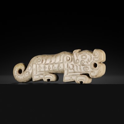 Lot 75 - A FINE AND LARGE WHITE JADE ‘TIGER’ PENDANT, SHANG DYNASTY