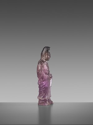Lot 41 - A CARVED AMETHYST FIGURE OF GUANYIN, QIANLONG MARK AND OF THE PERIOD