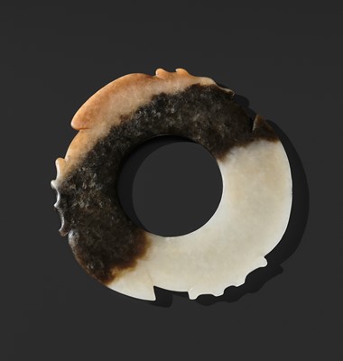 Lot 67 - A RARE WHITE, BROWN, AND RUSSET JADE NOTCHED DISK (YABI), LATE NEOLITHIC PERIOD, DAWENKOU OR LONGSHAN CULTURE