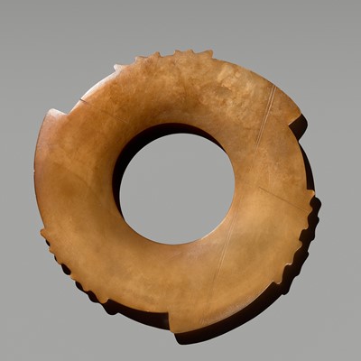 A SPLENDID YELLOW JADE NOTCHED DISK (YABI), LATE NEOLITHIC PERIOD, DAWENKOU OR LONGSHAN CULTURE