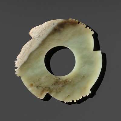 Lot 225 - A FINE PALE CELADON AND BROWN JADE NOTCHED DISK (YABI), LATE NEOLITHIC PERIOD, DAWENKOU OR LONGSHAN CULTURE