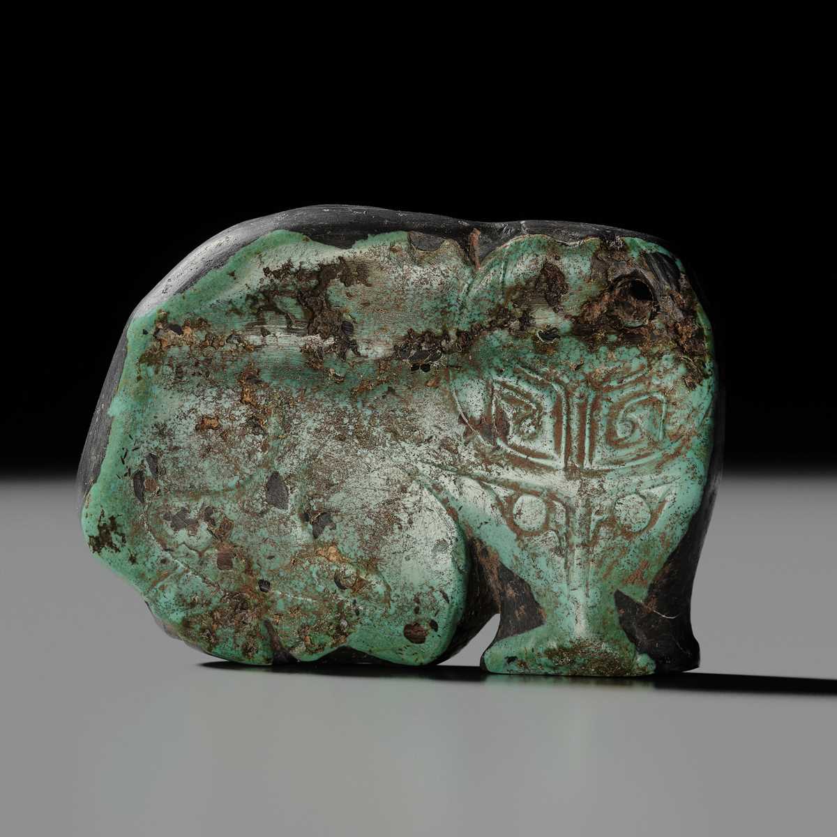 Lot 80 - A VERY RARE TURQUOISE ‘WATER BUFFALO’ PENDANT, LATE SHANG TO EARLY WESTERN ZHOU DYNASTY