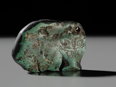 Lot 80 - A VERY RARE TURQUOISE ‘WATER BUFFALO’ PENDANT, LATE SHANG TO EARLY WESTERN ZHOU DYNASTY