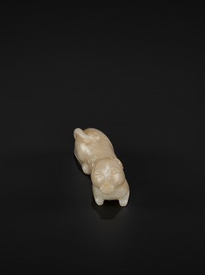 Lot 79 - A PALE GRAY JADE FIGURE OF A RECUMBENT HOUND, TANG TO SONG DYNASTY