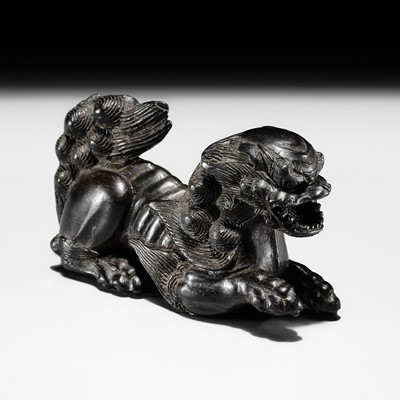 MASAKIYO: A LARGE AND UNUSUAL EBONY WOOD NETSUKE OF A SHISHI