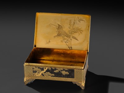 Lot 18 - KOMAI: A SUPERB GOLD-DAMASCENED IRON ‘PEACOCK AND PEAHEN’ BOX AND COVER
