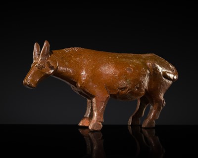 Lot 239 - AN AMBER-GLAZED RED POTTERY FIGURE OF AN OX, HAN DYNASTY