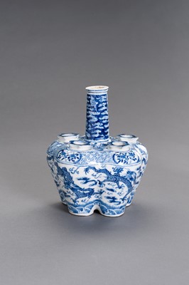 Lot 390 - A BLUE AND WHITE PORCELAIN ‘DRAGONS’ TULIP VASE, QING DYNASTY