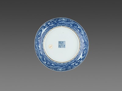 Lot 272 - A BLUE AND WHITE REVERSE-DECORATED “DRAGON” DISH, DAOGUANG MARK AND PERIOD