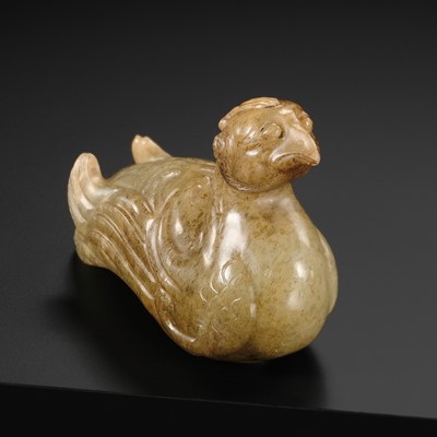Lot 115 - A PALE CELADON AND BROWN JADE STAFF FINIAL IN THE FORM OF A BIRD, SONG DYNASTY