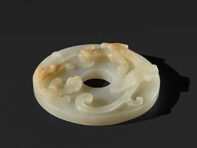 Lot 270 - AN ARCHAISTIC WHITE JADE ‘CHILONG’ DISC (BI), QING DYNASTY