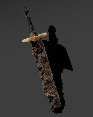 Lot 208 - A BRONZE FRAGMENT OF A SWORD WITH A JADE SWORD GUARD, WARRING STATES PERIOD TO HAN DYNASTY