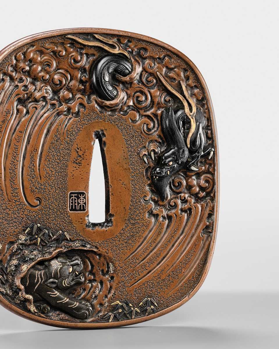 Lot 57 - TSUCHIYA YASUCHIKA V: A LARGE AND SUPERB SUAKA ‘DRAGON’ TSUBA