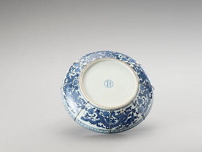 Lot 705 - A LARGE BLUE AND WHITE PORCELAIN ‘DRAGON’ CHARGER