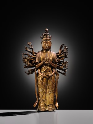 Lot 107 - A HIGHLY IMPORTANT AND EXCEEDINGLY RARE GILT-BRONZE FIGURE OF SENJU KANNON, THE THOUSAND-ARMED AND ELEVEN-HEADED AVALOKITESHVARA, C. 1300-1450
