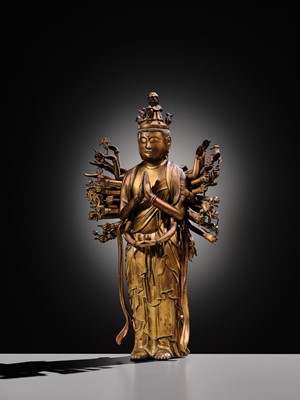 Lot 107 - A HIGHLY IMPORTANT AND EXCEEDINGLY RARE GILT-BRONZE FIGURE OF SENJU KANNON, THE THOUSAND-ARMED AND ELEVEN-HEADED AVALOKITESHVARA, C. 1300-1450
