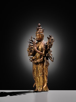 Lot 107 - A HIGHLY IMPORTANT AND EXCEEDINGLY RARE GILT-BRONZE FIGURE OF SENJU KANNON, THE THOUSAND-ARMED AND ELEVEN-HEADED AVALOKITESHVARA, C. 1300-1450