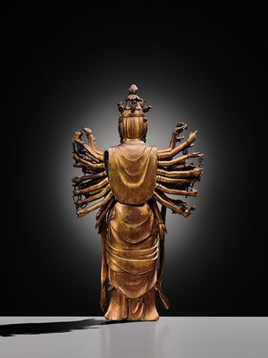 Lot 107 - A HIGHLY IMPORTANT AND EXCEEDINGLY RARE GILT-BRONZE FIGURE OF SENJU KANNON, THE THOUSAND-ARMED AND ELEVEN-HEADED AVALOKITESHVARA, C. 1300-1450