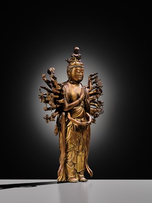 Lot 107 - A HIGHLY IMPORTANT AND EXCEEDINGLY RARE GILT-BRONZE FIGURE OF SENJU KANNON, THE THOUSAND-ARMED AND ELEVEN-HEADED AVALOKITESHVARA, C. 1300-1450