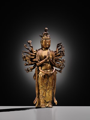 Lot 107 - A HIGHLY IMPORTANT AND EXCEEDINGLY RARE GILT-BRONZE FIGURE OF SENJU KANNON, THE THOUSAND-ARMED AND ELEVEN-HEADED AVALOKITESHVARA, C. 1300-1450