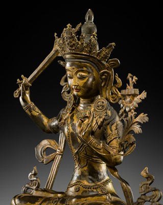 Lot 76 - A LARGE (66 CM) INLAID GILT-COPPER ALLOY FIGURE OF MANJUSHRI, NEPAL, EARLY TO MID-20TH CENTURY