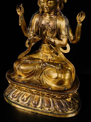 Lot 75 - A LARGE AND FINELY INLAID SINO-TIBETAN GILT-BRONZE FIGURE OF THE FOUR-ARMED GUANYIN, SHADAKSHARI LOKESHVARA, MING DYNASTY, 16TH TO EARLY 17TH CENTURY