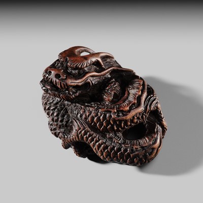 TADATOSHI: A FINE NAGOYA SCHOOL WOOD NETSUKE OF A COILED DRAGON