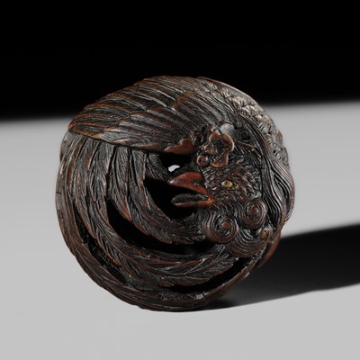 TOYOKAZU: A VERY FINE WOOD RYUSA MANJU NETSUKE DEPICTING KIRI NO HO-O