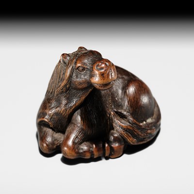 MASAMICHI: A FINE YAMADA SCHOOL WOOD NETSUKE OF A RECLINING HORSE