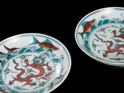 Lot 174 - A PAIR OF DOUCAI 'DRAGON AND CARP' DISHES, YONGZHENG MARKS AND PERIOD