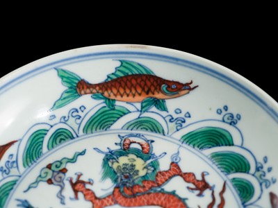 Lot 174 - A PAIR OF DOUCAI 'DRAGON AND CARP' DISHES, YONGZHENG MARKS AND PERIOD