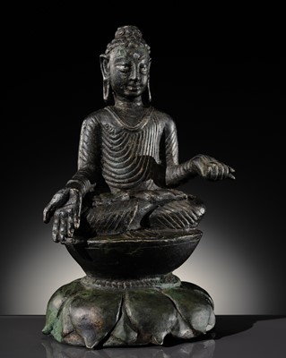 Lot 412 - A COPPER-ALLOY FIGURE OF BUDDHA SHAKYAMUNI WITH SILVER-INLAID EYES, SWAT VALLEY, 7TH-8TH CENTURY