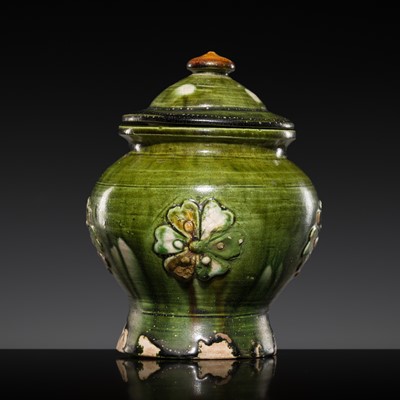 Lot 244 - A RARE APPLIQUÉ-DECORATED SANCAI GLAZED JAR AND COVER, TANG DYNASTY