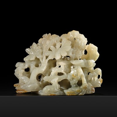 Lot 215 - A RETICULATED CELADON AND RUSSET JADE ‘ROCK, DEER, AND LINGZHI’ GROUP, SONG-YUAN DYNASTY