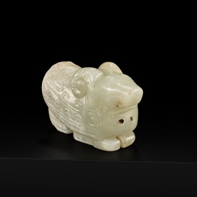 Lot 203 - A RARE PALE GREEN JADE CARVING OF AN OWL, WESTERN ZHOU DYNASTY