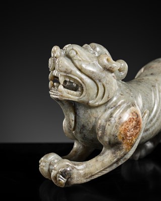 Lot 220 - A CELADON JADE FIGURE OF A BIXIE, 17TH-18TH CENTURY