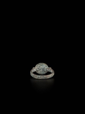 Lot 1254 - A PERSIAN BRONZE RING WITH RUBY INTAGLIO OF A HORSE, EX-COLLECTION MOHAMMAD REZA PAHLAVI
