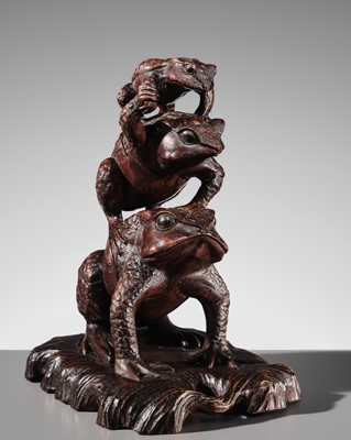 A LARGE AND UNUSUAL WOOD OKIMONO OF THREE TOADS