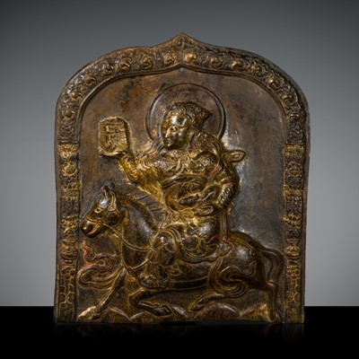 Lot 56 - A GILT COPPER-ALLOY REPOUSSÉ PLAQUE OF PANCHIKA, TIBET, 17TH-18TH CENTURY