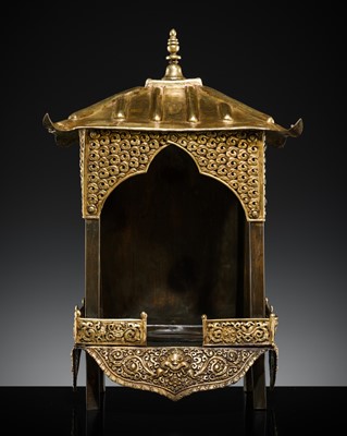 Lot 27 - A PARCEL-GILT COPPER ALLOY REPOUSSÉ BUDDHIST SHRINE, TIBET, 19TH CENTURY AND EARLIER