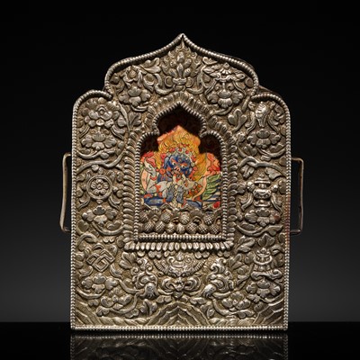 Lot 21 - A REPOUSSÉ SILVER AND COPPER GAU WITH A PAINTING OF MAHAKALA AND CONSORT, 18TH-19TH CENTURY