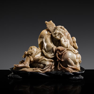 Lot 190 - A SOAPSTONE FIGURE OF A LUOHAN, LATE QING DYNASTY