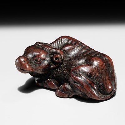 MASANAO: A FINE AND EARLY WOOD NETSUKE OF A RECUMBENT OX