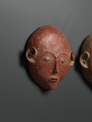 Lot 777 - A PAIR OF CERAMIC ANCESTRAL MASKS